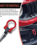 Red Alloy Car Front Bumper Tow Hook With Foldable Design, Rust Proof Recovery Ring for Fast Grab and Go Trail Rescue installed on vehicle.