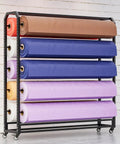 Heavy Duty Rolling Metal Storage Rack With Adjustable Shelves Caster Wheels And Ten Hanging Bars Slick Powder Coated Finish holding rolls of fabric.