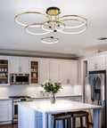 Dimmable 90W LED Ceiling Chandelier With Remote Control, Dope Gold Six Ring Flush Mount Light Fixture For Living Room, Kitchen, Bedroom, 3000K-6000K, 41.3 Inch installed in a modern kitchen.