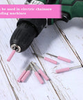 Diamond Chainsaw Sharpener Kit 32 Pieces Pink Sharpeners With 0.22 Inch Heads displayed with drill attachment