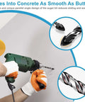 Ocasar 12-piece masonry and concrete drill bit set; side view of worker with green drill drilling a wall.