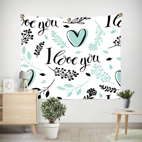 Wall tapestry with 'I love you' message, teal heart and floral design, decorated with brass fasteners in a modern room setting.