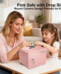 Woman and child using Pink Mini Safe For Kids And Home Portable Lock Box With Key For Money Cash Documents Dorm Room Safe.