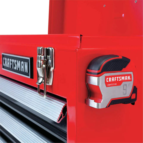 9 Foot Tape Measure With Bottle Opener, Small Magnetic Measuring Tool With Rubber Overmold Grip attached to red toolbox