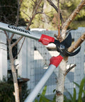 30 Inch Bypass Lopper With Comfort Gel Grips And Shock Guard cutting tree branch, dual arc nonstick blades in action