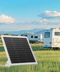 20W 12V Solar Battery Trickle Charger Maintainer With Built In MPPT Controller Mono Solar Panel in grass with RV in background