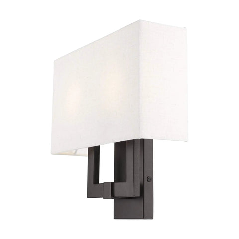 Meridian Collection Transitional Two Light Wall Sconce In English Bronze Finish With Warm Oatmeal Fabric Shade And A Sleek Angular Arm