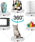 Awesome Electric Turntable For Live Video Broadcasts With Remote Speed Control And 22 To 60 Second Rotation Timing showcasing various items like a vase, wine bottles, and a cat.