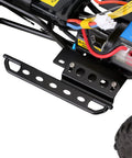 Close-up of black metal side pedal rock slider for 1/24 RC crawler, showcasing heavy-duty armor upgrade with abrasion resistant protection.