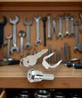 Universal Stainless Toolbox Lock With 180 Degree Rotation For Cabinets And Drawers Built Tough Cylinder Lock Includes 2 Keys And 1 Fastening Tab Fits Most Toolboxes And Cabinets, silver lock and keys on workbench