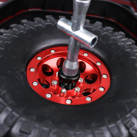 Close-up of red RC car wheel with 4 Pack Aluminum RC Car Wheel Center Cap Adapters With M4 Nuts, CNC Machined And Anodized Black