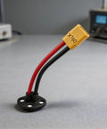 High Performance Xt60 Male To 3 Pin Power Socket Adapter With Nickel Plated Brass Contacts installed on a black base, showing red and black wires.