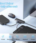 Four Port USB 3.0 Hub Splitter For Laptop, Xbox, And PC Accessories connected to various devices on a desk
