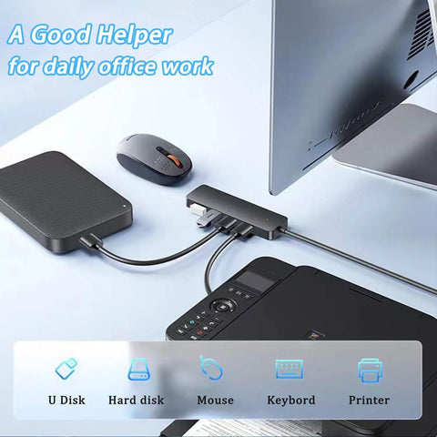 Four Port USB 3.0 Hub Splitter For Laptop, Xbox, And PC Accessories connected to various devices on a desk