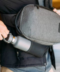 Lightweight 6L Crossbody Sling Bag For Travel And Everyday Carry with water bottle holder in use, anti theft pocket system visible.