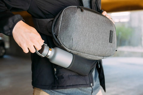 Lightweight 6L Crossbody Sling Bag For Travel And Everyday Carry with water bottle holder in use, anti theft pocket system visible.