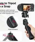 Hand holding One-Click Opening Vlogging Tripod With Quick-Release System, Cold Shoe Mount; camera mounted, push to extend feature.