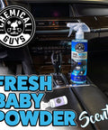 Chemical Guys Total Interior Cleaner & Protectant spray bottle on car center console, blue bottle with trigger, 16 oz