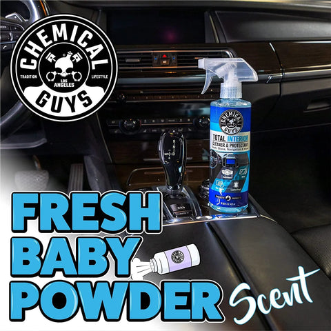 Chemical Guys Total Interior Cleaner & Protectant spray bottle on car center console, blue bottle with trigger, 16 oz
