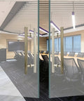 Beefy Bronze Stainless Steel Double Sided H Shape Push Pull Door Handle For Barn Sliding Doors Interior And Exterior Use Anti Rust Smooth Finish Available In 24 Inch And 59 Inch Length Includes Pair For Both Sides installed on glass doors in modern office.