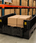 Kickass Workhorse Industrial Grade Collapsible Bulk Box With 1700 Pound Capacity containing brown boxes in a warehouse setting.