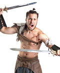 Man wearing Medieval Viking Belt And Faux Leather Arm Guards Bracers Set 3 Piece For Cosplay, holding swords, ready for battle