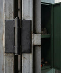 16 Piece Beefy Weld On Hinges Set Heavy Duty 3 Inch Steel Butt Hinges on a metal gate in garage setting