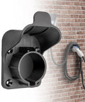 EV Charger Holder for SAE J1772 Cords, wall mount design in durable PA plastic, neatly organizing charging cable on brick wall.