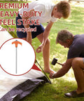 Fifty Pack Eight Inch Screw In Tent Stakes Heavy Duty Ground Stakes With Hex Head Driver Metal Pegs Spikes For Camping Garden Yard Orange shown in use during tent setup outdoors.