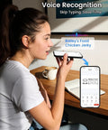 Young woman using voice recognition feature on smartphone for labeling with Super Duper Cool M110 Wireless Bluetooth Label Printer.