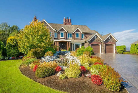 Real Deal Wet Look High Gloss Concrete And Paver Sealer For Exterior Patios Featuring Five Gallon Container on beautifully landscaped home entrance.