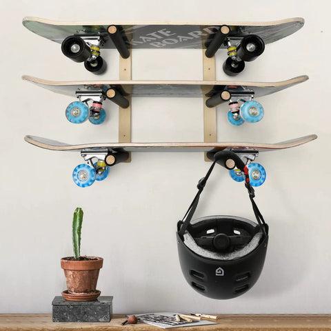 Handcrafted Natural Wood Wall Mount Skateboard Rack Holds Three Longboards And Snowboards Featuring Protective Cushioned Sleeves, displaying skateboards and helmet.