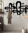 Slick Mid Century Metal Coat Rack With Abstract Wall Hooks Top Shelf Luxury Entryway Decor featuring jackets and accessories.