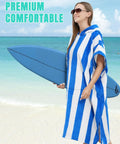 Woman holding surfboard in Hooded Surf Poncho Towel For On The Go Privacy Women Men Changing Robe with front pocket at beach