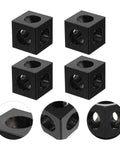 Four Pack Aluminum Extrusion Corner Brackets For 3D Printer Frames Cube Slot Connectors Industrial Aluminum Profile Accessories For DIY Frame Building And Structural Support. Shown are black, cube-shaped brackets with circular holes, demonstrating structural detail from multiple angles.