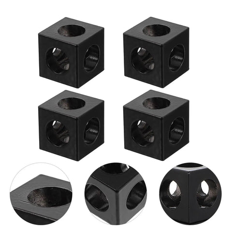Four Pack Aluminum Extrusion Corner Brackets For 3D Printer Frames Cube Slot Connectors Industrial Aluminum Profile Accessories For DIY Frame Building And Structural Support. Shown are black, cube-shaped brackets with circular holes, demonstrating structural detail from multiple angles.