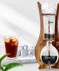 Portable Cold Brew Drip Tower With Smooth Flow Dial And Hefty 1000 Milliliter Pitcher For Chilling Bold Iced Coffee Creations And Nitro Blends displayed with iced coffee.