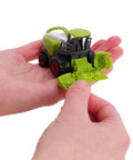 Person holding a green die-cast forage harvester, part of a Five Piece Green Die Cast Farm Machinery Toys Set With Mini Tractors And Harvesters.