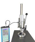 Portable Ultrasonic Hardness Tester With Sturdy Test Stand And Fine Probe 1kgf Load measuring metal on a solid base.