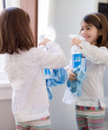 Child using Streak Free Glass Cleaner Spray For Windows, Mirrors, Screens And Shower Doors, Removes Fingerprints Dust And Dirt