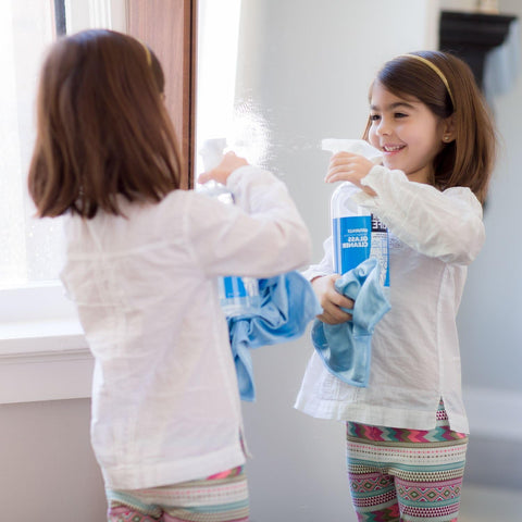 Child using Streak Free Glass Cleaner Spray For Windows, Mirrors, Screens And Shower Doors, Removes Fingerprints Dust And Dirt