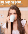 Woman holding a mug from Huge 16 Ounce Ceramic Coffee Mugs 4 Pack White Set Durable Stoneware Cups For Coffee Tea Heat Retention