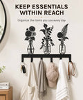 Knockout Premium Decorative Floral Metal Wall Coat Rack Featuring Six Heavy Duty Hooks And Matte Black Finish for keys and hats hanging.