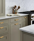 Antique Brass Cabinet Drawer Pulls 10 Pack Zinc Alloy Cup Pulls installed in modern kitchen cabinets and drawers
