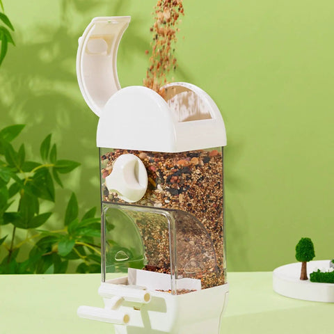 Bird Parent Approved House Shaped Automatic Bird Feeder And Water Dispenser For Parrots And Parakeets Clear large capacity feeder with grains pouring in.