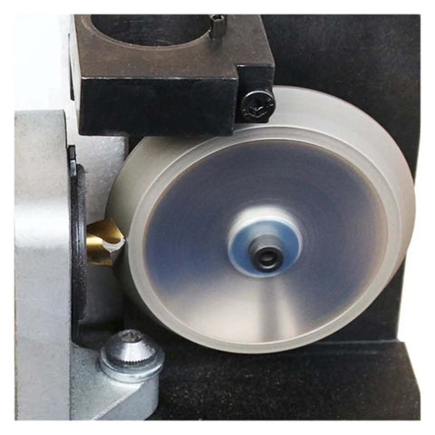 Close-up of Premium Twist Drill Bit Sharpener For 3 To 13MM Hss And Carbide Bits with grinding wheel in action.
