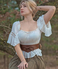 Dope Renaissance Obi Belt With Snatched Medieval Leather Corset Style Game Changing Wide Cinch Strap worn with white top and skirt.