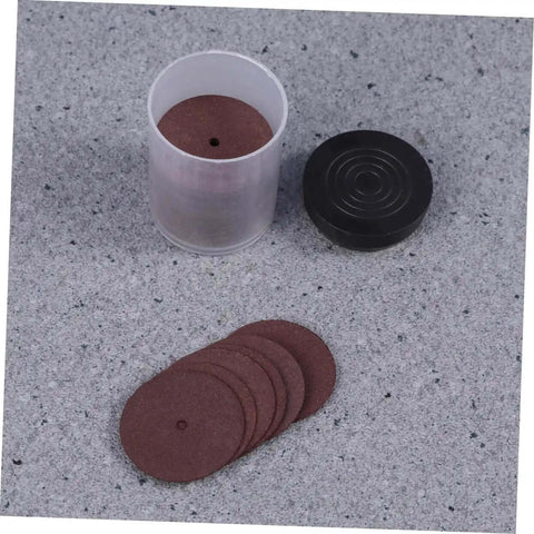 Set of 36 piece heavy duty cutting wheels and grinding discs for cutters, shown with open plastic container and discs on a gray surface