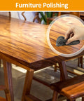 Steel wool pad 0000 used to polish a wooden table; extra-fine gray wool