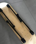 Sweet Set Of Four Portable Folding Table Legs Crafted From Skateboards And Longboards With Protective Floor Pads shown with black iron legs